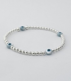 PULSERA ELASTIZADA CON BOLITAS DE PLATA Y 4 IJOTOS CELESTES